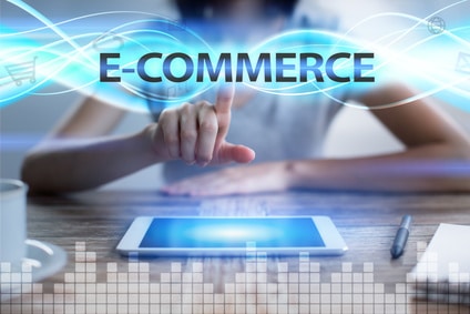 Woman using tablet pc, pressing on virtual screen and selecting e-commerce.